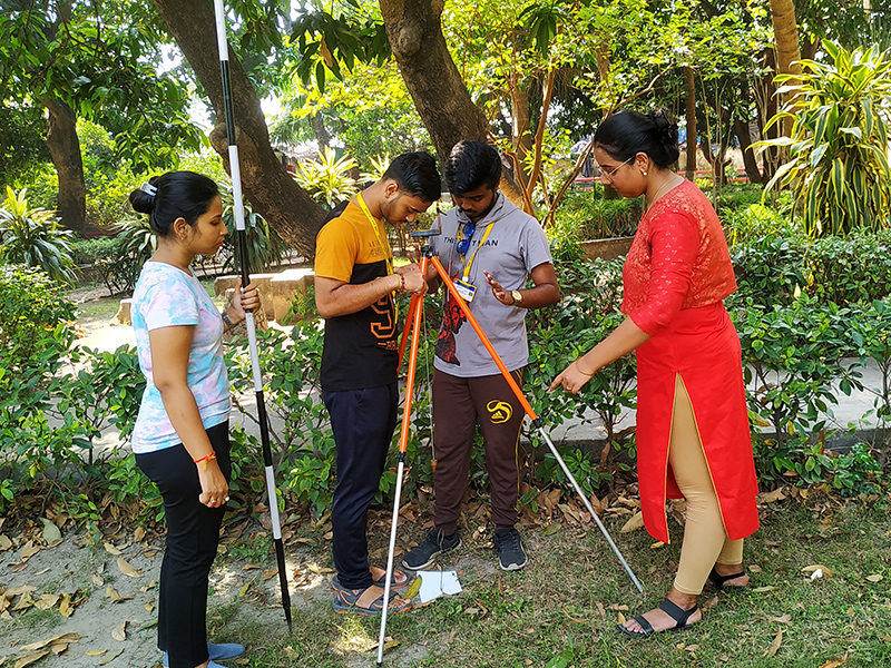 Precision in practice - Geography students engaged in Instrumental Surveying